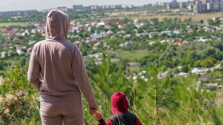 Mom son overlooking city for concept design.の写真素材