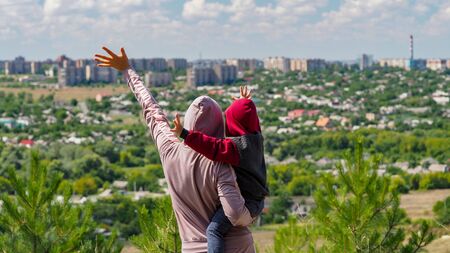 Mom son overlooking city for concept design.の写真素材
