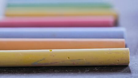 Selective focus on crayons for drawing on asphalt in different colorsの写真素材