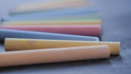 Selective focus on crayons for drawing on asphalt in different colorsの写真素材