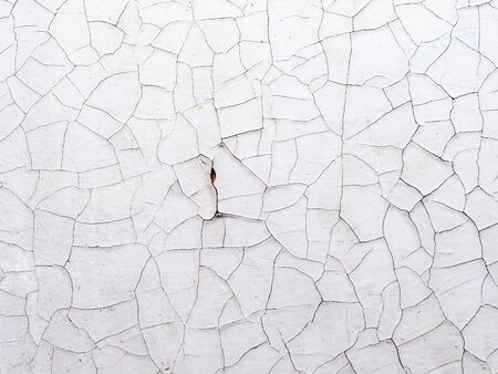Spider- like cracks on the white surfac