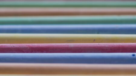 Selective focus on crayons for drawing on asphalt in different colorsの写真素材