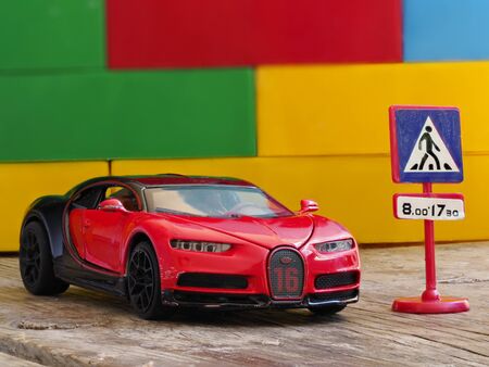 Children's toy sports car is on the tableの写真素材