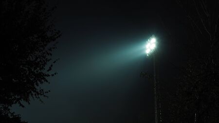 Floodlights at the stadium at nightの写真素材