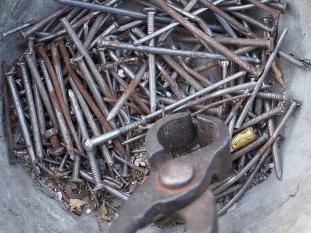 Background of old nails and iron wire cuttersの写真素材