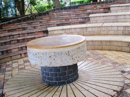 Ceramic round table in a park, closeup of photoの写真素材