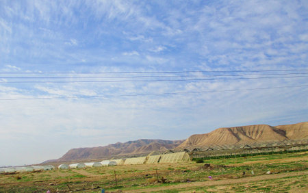 greenhouses in the mountains, closeup of photo on blue sky backgroundの写真素材