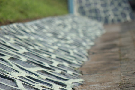 Wet stone walkway in the park, closeup of photoの写真素材