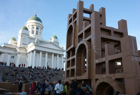 Helsinki, Finland - August 21, 2014 - Large crowd of people constructing cardboard skyscrapers together by using cardboard and tape at the Senate Square in the center of Helsinki, Finland at the annual Night of Arts event which is part of the Helsinki Fesのeditorial素材