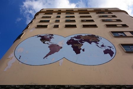 Havana, Cuba - December 26, 2013 - Deteriorating world map on the exterior of the old Masonic Grand Lodge building that was built in early 50's in the center of Havana, Cuba against blue sky on December 26, 2013.のeditorial素材