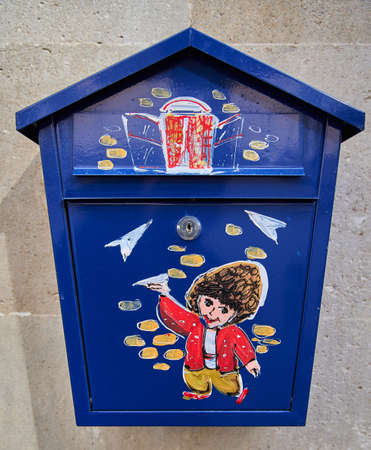 Baku, Azerbaijan - February 11, 2020: Artistic and colourful local mailbox with traditional Azerbaijani subjects painted on the front in downtown Baku.のeditorial素材