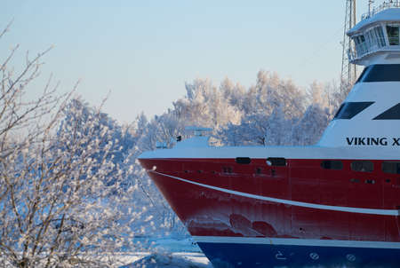 Helsinki, Finland - January 15, 2021: M/S Viking XPRS ferry arriving to Helsinki from Tallinn in extremely cold winter conditions through narrow Kustaanmiekka strait.のeditorial素材