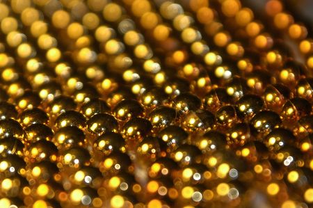 Several strings of beads lying next to each other.の写真素材