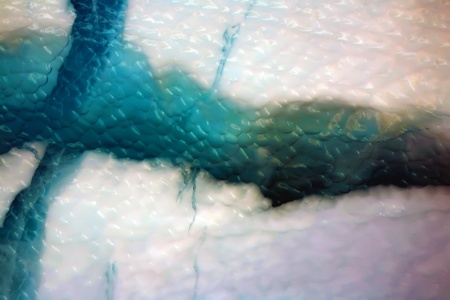 cracked ice surface texture looks like finland flagの写真素材