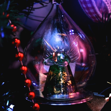 Christmas decoration: glass angel on the Christmas tree. Square format.の写真素材