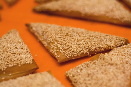 Puff pastry filled with cheese, orange background, selective focus.の写真素材