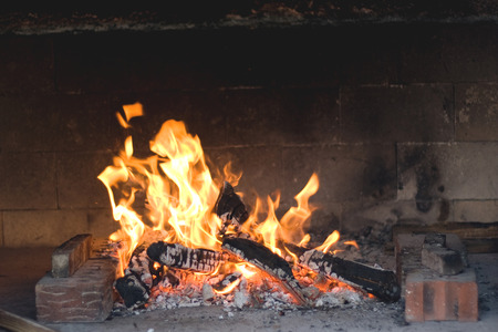 Fire burning in the fireplace.の写真素材