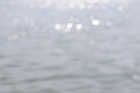 Light reflecting in the sea - unfocused abstract background.