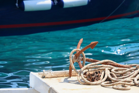 Rustic anchor on a small wooden boat. In Hvar, Croatia. Selective focus.の写真素材