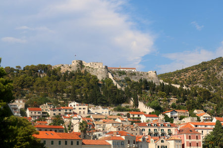 Town Hvar on island Hvar, Croatia. View of the Hvar Fortress at the top of the hill.のeditorial素材