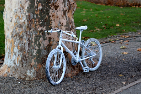 Bicycle painted white and used as a decoration. Selective focus.の写真素材