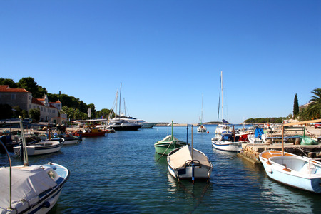 Small fishing boats in the port of Maslinica, town on island Solta.の写真素材