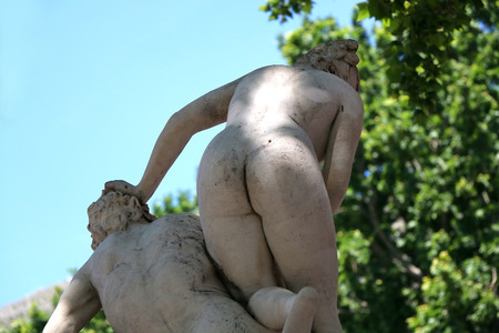 Statue on a fountain in a park, in Dubrovnik, Croatia. Focused on the buttocks.の写真素材