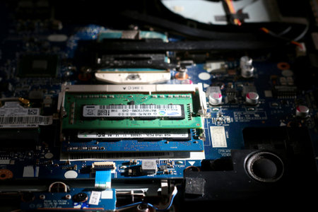 Split, Croatia - August 1, 2018: Disassembling a notebook, view of notebook components with focus on RAM. Selective focus.のeditorial素材