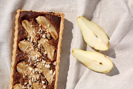 Tart with pear and almond filling and decoration. Top view, close-up.の写真素材
