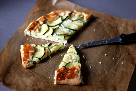 Galette made with courgette and cheese (ricotta, mozzarella, parmesan). Selective focus.の写真素材