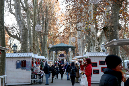 Zagreb, Croatia - November 29, 2016: People enjoying festive atmospehere on a Christmas fair in park Zrinjevac, Zagreb, Croatia. Zagreb is popular Advent travel destination.のeditorial素材