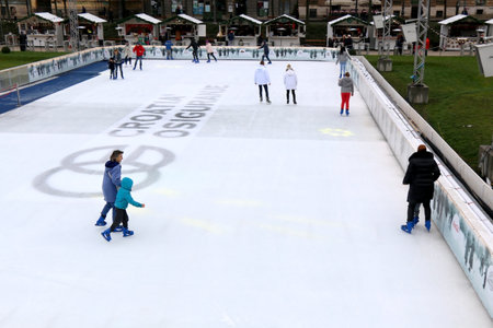 Zagreb, Croatia - November 27, 2016: People enjoying Christmas atmosphere at the ice skating rink on King Tomislav Square in Zagreb, Croatia. Zagreb is popular Advent travel destination.のeditorial素材