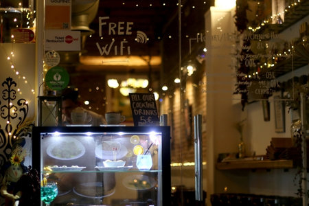 Barcelona, Spain - July 5, 2018: Window of a colorful restaurant on the streets of Barcelona, Spain at night.のeditorial素材
