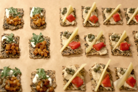 Various finger sandwiches assembled on a parchment paper. Selective focus.の写真素材