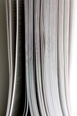 Open book, close-up on pages. Selective focus, white background.の写真素材