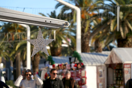 Split, Croatia - December 18, 2018: People enjoying Christmas atmosphere and sunny winter day on Riva Promenade in Split, Croatia. Split is popular travel destination in Croatia.のeditorial素材