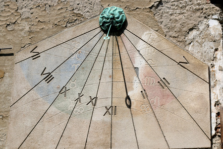 Historical sun clock on a building in Zagreb, Croatia.の写真素材