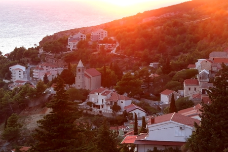 Aerial view of Mimice, small tourist town near Omic, Croatia, during beautiful sunset.の写真素材
