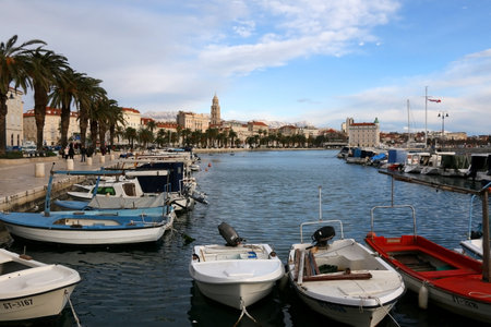 Split, Croatia - January 2, 2019: Small boats in port of Split, Croatia. Landmark Saint Domnius bell tower in the background. Split is popular summer travel destination.のeditorial素材