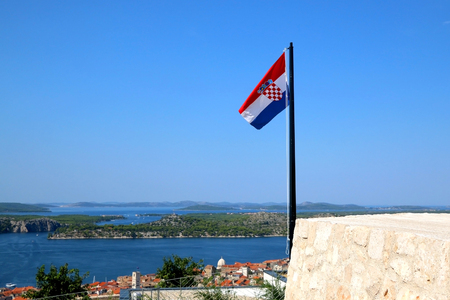 Croatian flag on historical Barone Fortress in Sibenik, Croatia. Sibenik is popular summer travel destination.の写真素材