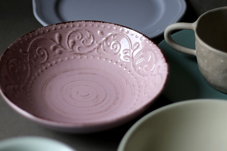 Collection of pottery and kitchenware in muted pastel colors. Selective focus.の写真素材