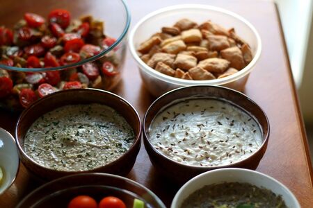 Table setting with galette, snacks, dips and salads. Selective focus.の写真素材