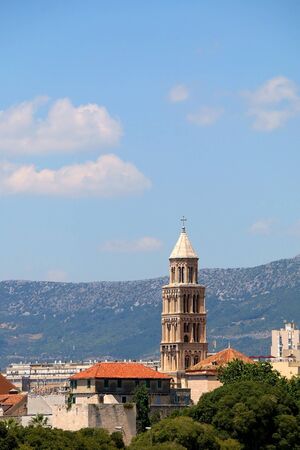 Saint Domnius bell tower, landmark in Split, Croatia, surrounded with trees.の写真素材