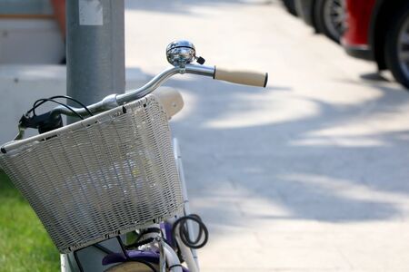 White basket and bell, details on a retro bike. Selective focus.の写真素材