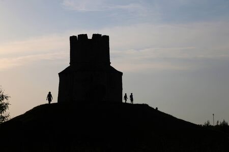 Silhouette of small medieval church of St. Nicholas and visitors around, near Nin, Croatia.の写真素材