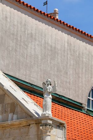 Architectural detail of historic Church of the Assumption on main square in town Pag, island Pag, Croatia.の写真素材