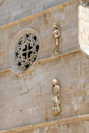 Architectural detail of historic Church of the Assumption on main square in town Pag, island Pag, Croatia.の写真素材