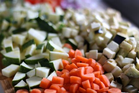 Various sliced vegetables: carrot, zucchini, eggplant, tomato and onion. Selective focus.の写真素材