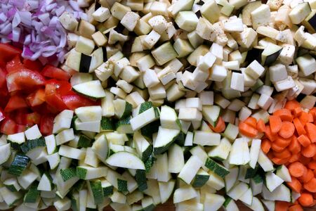 Various sliced vegetables: carrot, zucchini, eggplant, tomato and onion. Top view.の写真素材