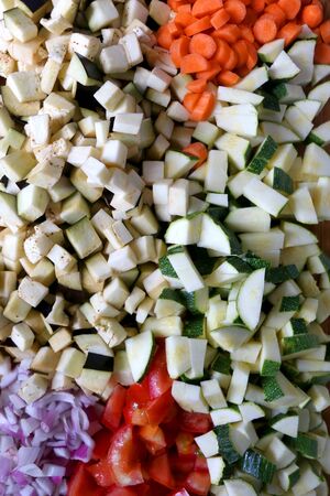 Various sliced vegetables: carrot, zucchini, eggplant, tomato and onion. Top view.の写真素材